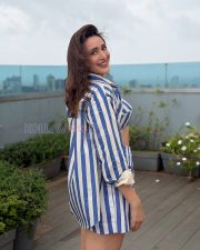 Playful Actress Pragya Jaiswal in a Blue and White Striped Crop Top and Mini Skirt Photos 03