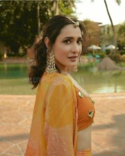 Pragya Jaiswal in an Orange Lehenga with Mirror Blouse Pictures 02