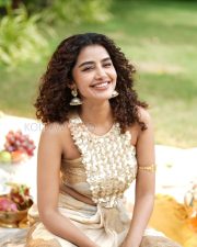 Radiant Actress Anupama Parameswaran in a Gold Cream Saree with Floral Blouse Photos 02