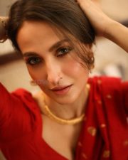 Radiant Actress Elli AvrRam in a Red Saree with Backless Blouse Photos 02