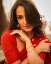 Radiant Actress Elli AvrRam in a Red Saree with Backless Blouse Photos 03