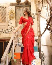 Radiant Actress Elli AvrRam in a Red Saree with Backless Blouse Photos 09