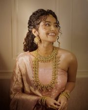 Radiant Anupama Parameswaran in a Golden Pink Silk Saree with a Strapless Blouse Photos 04