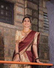 Radiant Nabha Natesh in a Traditional Maroon and Gold Half Saree Photos 01