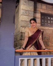 Radiant Nabha Natesh in a Traditional Maroon and Gold Half Saree Photos 02