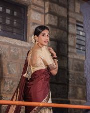 Radiant Nabha Natesh in a Traditional Maroon and Gold Half Saree Photos 05