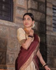 Radiant Nabha Natesh in a Traditional Maroon and Gold Half Saree Photos 08
