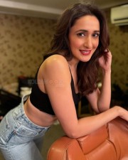 Ravishing Pragya Jaiswal in a Sleeveless Chick Blcak Top Blue Denim and Red Lipstick Photos 04