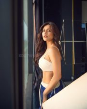 Sassy Nabha Natesh in a Blue Track Pant and White Sports Bra Photos 02