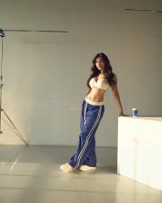 Sassy Nabha Natesh in a Blue Track Pant and White Sports Bra Photos 03