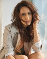 Sensual Pragya Jaiswal in an Oversized Trench Coach with a Pale Yellow and Blue Monokini Swimsuit Photos 01