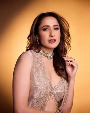 Sexy Pragya Jaiswal in a Shimmering Cream Bralette with a Palazzo and Shrug Photos 02