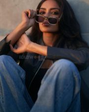 Sexy Sobhita Dhulipala in a Black Cropped Leather Jacket over a Black Scooped Neck Cropped Cami Top paired with Blue High Waisted Jeans Photos 03