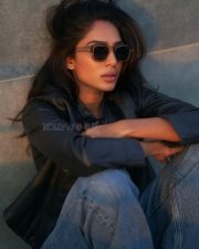 Sexy Sobhita Dhulipala in a Black Cropped Leather Jacket over a Black Scooped Neck Cropped Cami Top paired with Blue High Waisted Jeans Photos 04