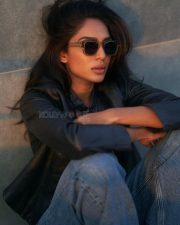 Sexy Sobhita Dhulipala in a Black Cropped Leather Jacket over a Black Scooped Neck Cropped Cami Top paired with Blue High Waisted Jeans Photos 04