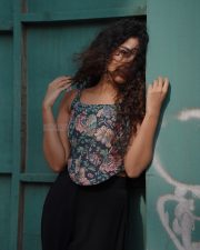 Sexy Stylish Anupama Parameswaran in a Floral Corset Top and Black Pants Photos 05