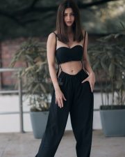 Sizzling Vedhika in Black Strapless Bra and Jumpsuit Photos 03