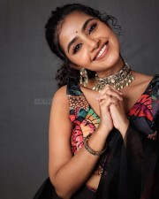 Smiling Anupama Parameswaran in a Sleeveless Blouse Pictures 01