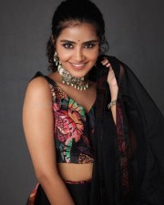 Smiling Anupama Parameswaran in a Sleeveless Blouse Pictures 02