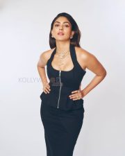 Sophisticated Actress Mrunal Thakur in a Black Halter Top with Layered Gold Jewelry Photos 04