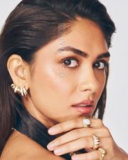 Sophisticated Actress Mrunal Thakur in a Black Halter Top with Layered Gold Jewelry Photos 07