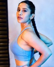 Striking Actress Nabha Natesh in a Blue Sports Bra Set Photos 01
