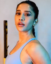 Striking Actress Nabha Natesh in a Blue Sports Bra Set Photos 02
