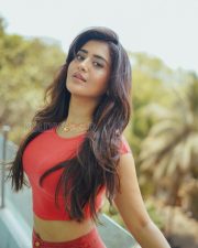 Striking Actress Rashi Singh in a Red Coral Crop Top And Button Skirt Photos 01