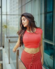 Striking Actress Rashi Singh in a Red Coral Crop Top And Button Skirt Photos 03