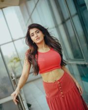 Striking Actress Rashi Singh in a Red Coral Crop Top And Button Skirt Photos 04