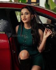 Stunning Nabha Natesh in a Dark Green Mini Dress with Long Boots Photos 04