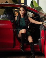 Stunning Nabha Natesh in a Dark Green Mini Dress with Long Boots Photos 05
