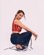Stunning Pragya Jaiswal in a Red Sleeveless Crop Top and Denim Pants Photos 01