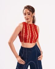 Stunning Pragya Jaiswal in a Red Sleeveless Crop Top and Denim Pants Photos 03