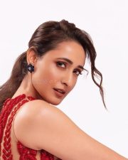 Stunning Pragya Jaiswal in a Red Sleeveless Crop Top and Denim Pants Photos 04