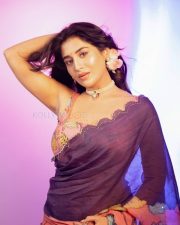 Stunning Rashi Singh Navel in a Purple Saree with Sleeveless Floral Printed Blouse Photos 03