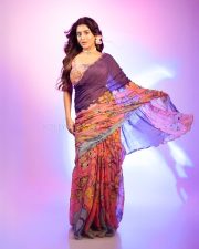 Stunning Rashi Singh Navel in a Purple Saree with Sleeveless Floral Printed Blouse Photos 05