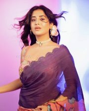Stunning Rashi Singh Navel in a Purple Saree with Sleeveless Floral Printed Blouse Photos 06