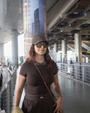 Stylish Actress Mrunal Thakur in a Brown Alo Cap and Brown Athleisure Outfit Photos 03
