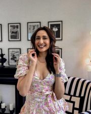 Stylish Pragya Jaiswal Cleavage in a Floral Mini Dress Photos 03