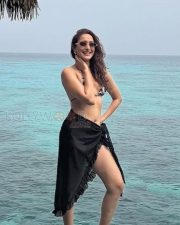 Stylish Pragya Jaiswal in a Black and White Triangle Style Bikini Top with a Sheer Sarong Wrap Pictures 01