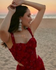 Stylish Pragya Jaiswal in a Red Dress at the Beach Photos 01