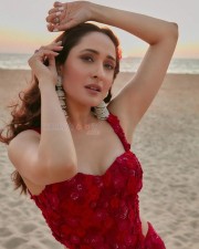 Stylish Pragya Jaiswal in a Red Dress at the Beach Photos 03