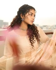 Tamil Actress Anupama Parameswaran in a Beige Royal Anarkali Dress Photos 02