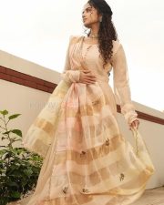 Tamil Actress Anupama Parameswaran in a Beige Royal Anarkali Dress Photos 04