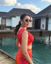 Vibrant Actress Pragya Jaiswal in a Red Crop Top Orange Floral Pants Photos 02