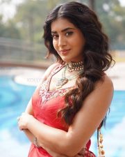 Vibrant Actress Rashi Singh in a Red Sleeveless Short Kurta with a Voluminous Red Lehenga Skirt Pictures 02