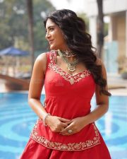 Vibrant Actress Rashi Singh in a Red Sleeveless Short Kurta with a Voluminous Red Lehenga Skirt Pictures 03