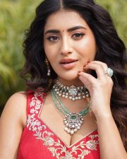 Vibrant Actress Rashi Singh in a Red Sleeveless Short Kurta with a Voluminous Red Lehenga Skirt Pictures 04