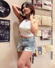 Vivacious Actress Srijita Ghosh in a White Tank Top And Distressed Denim Shorts Photos 03